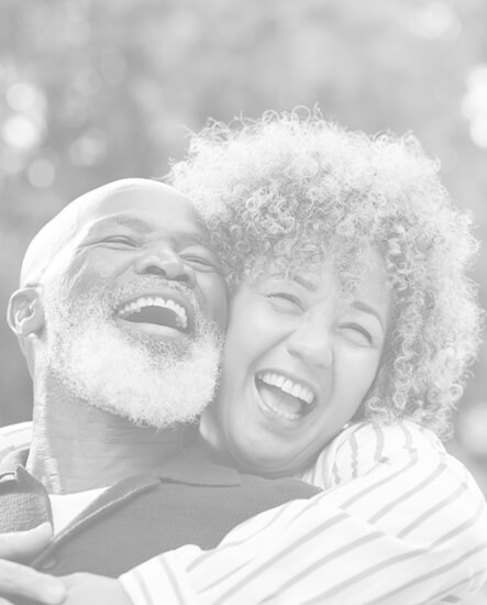 Happy couple embracing outside