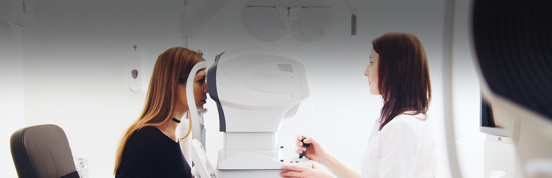 Woman having her eyes examined